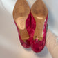 Bottom view showing sole wear of Louis Vuitton heels
