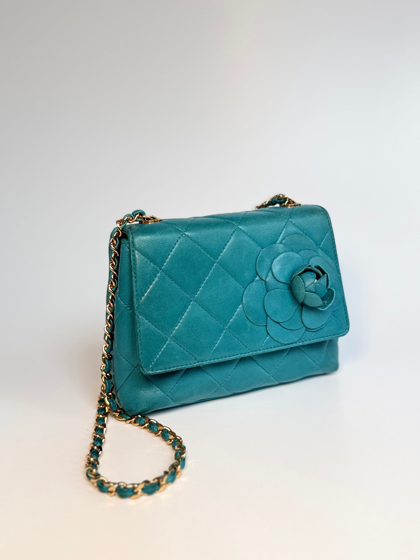 Chanel Mini Camellia Flap Bag in turquoise quilted leather with gold chain